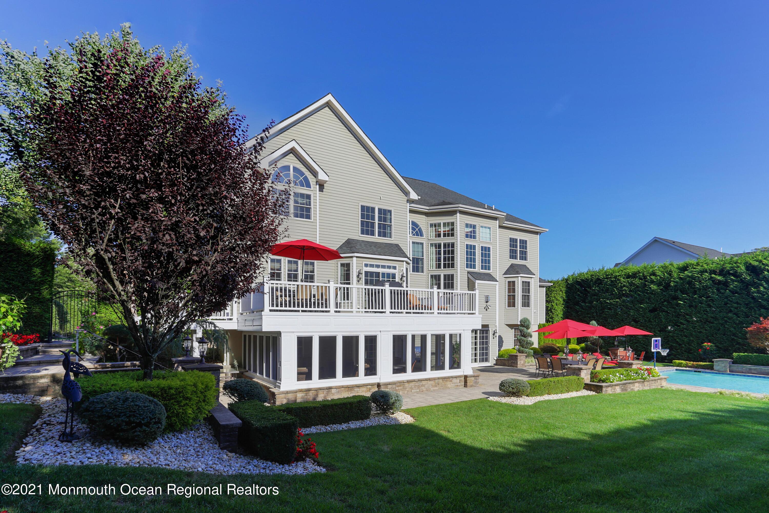 4 Yorktown Road Morganville, NJ 07751 - Photo 44 of 64 a front view of house with yard and green space