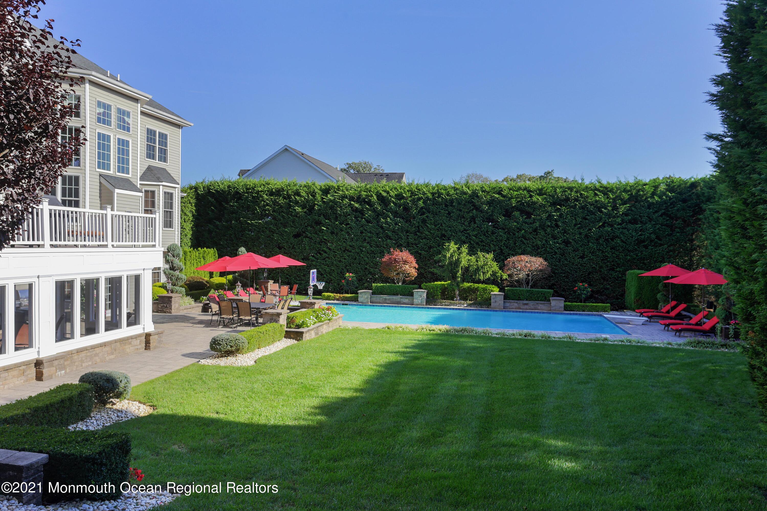 4 Yorktown Road Morganville, NJ 07751 - Photo 46 of 64 a childrens park with lots of swings and slides