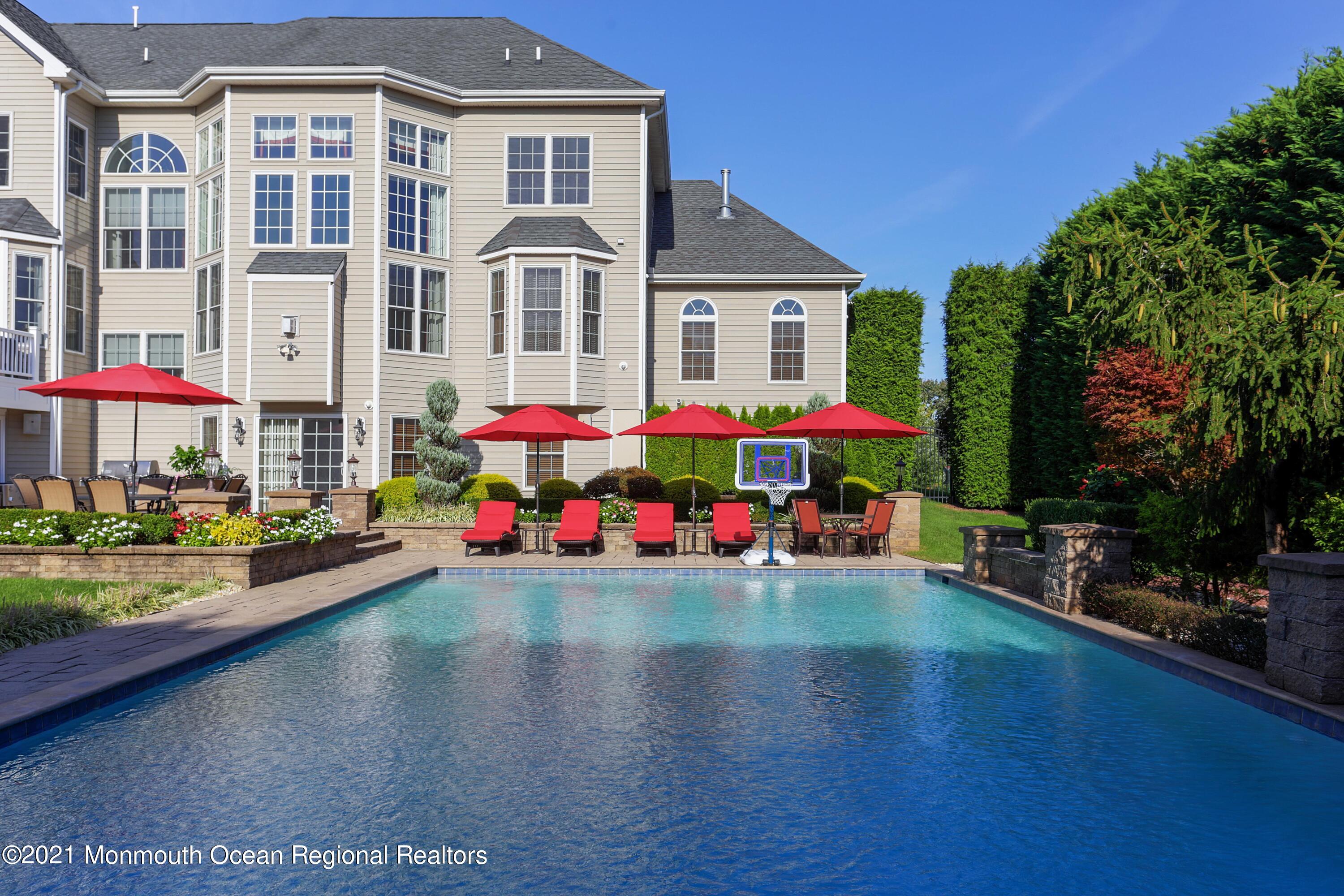 4 Yorktown Road Morganville, NJ 07751 - Photo 51 of 64 a front view of house with yard and outdoor seating