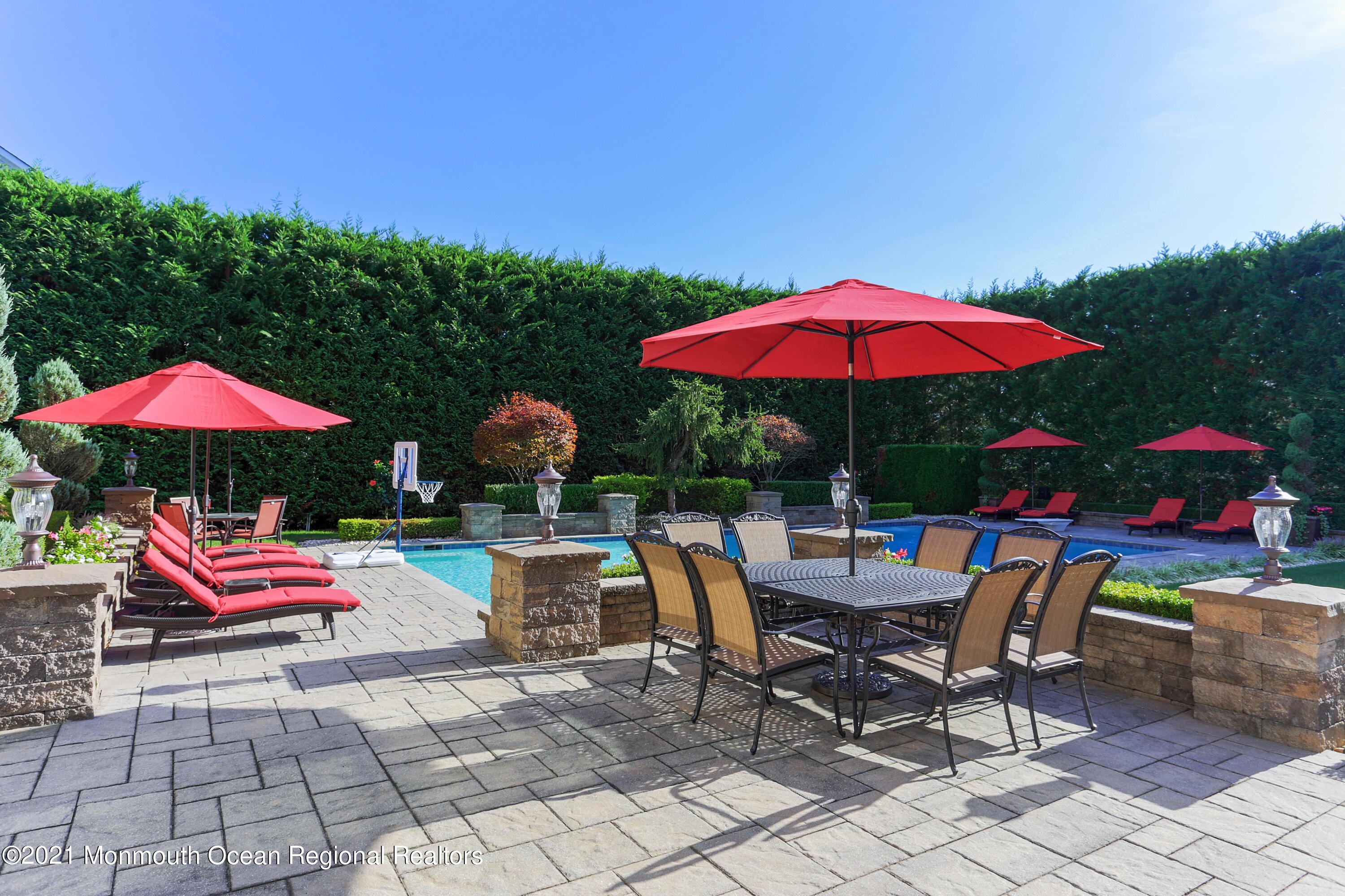 4 Yorktown Road Morganville, NJ 07751 - Photo 52 of 64 a view of backyard with seating and trees