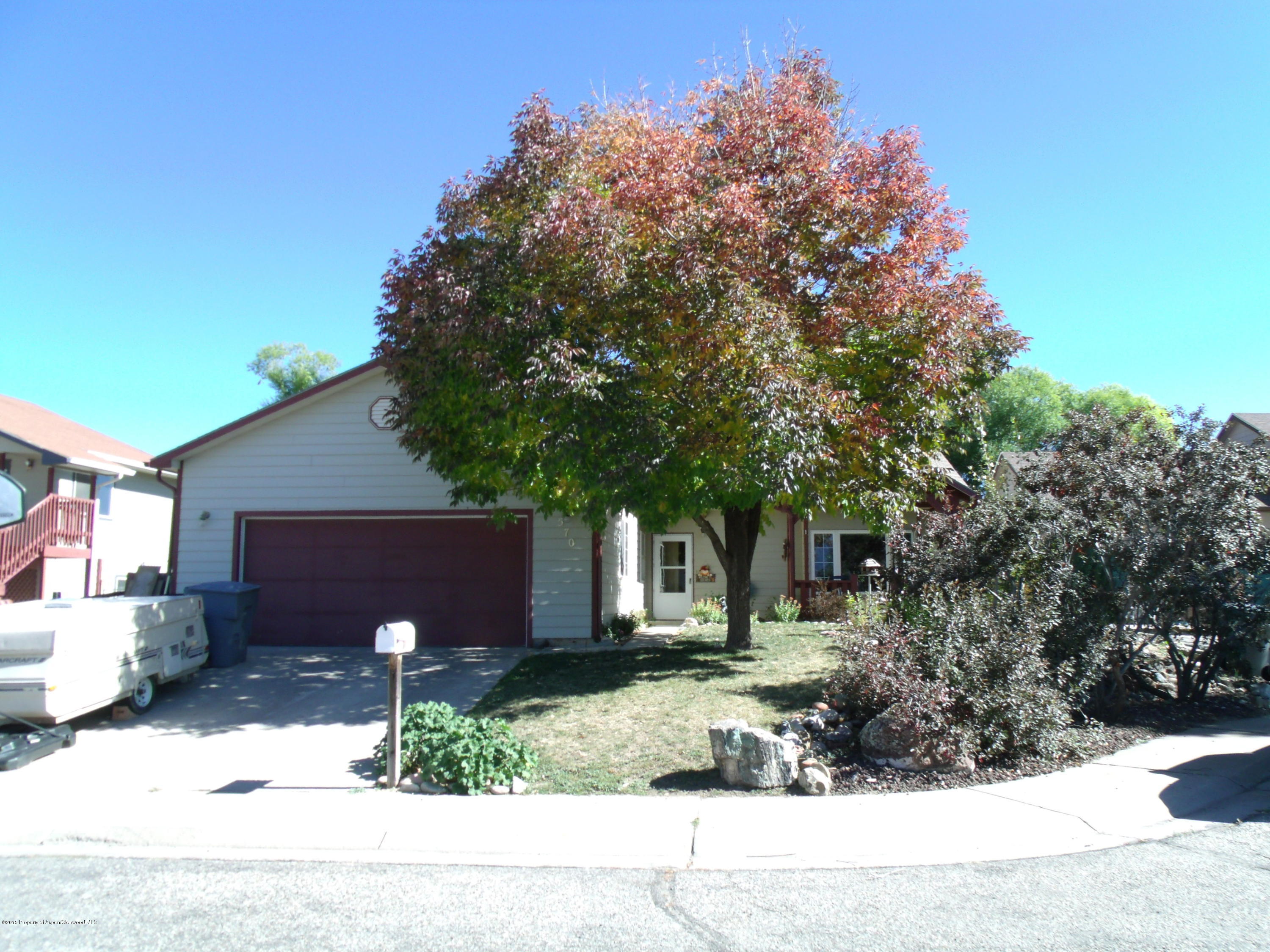 570 Elm Court Rifle, CO 81650 - Photo 1 of 15 a front view of a house with a yard