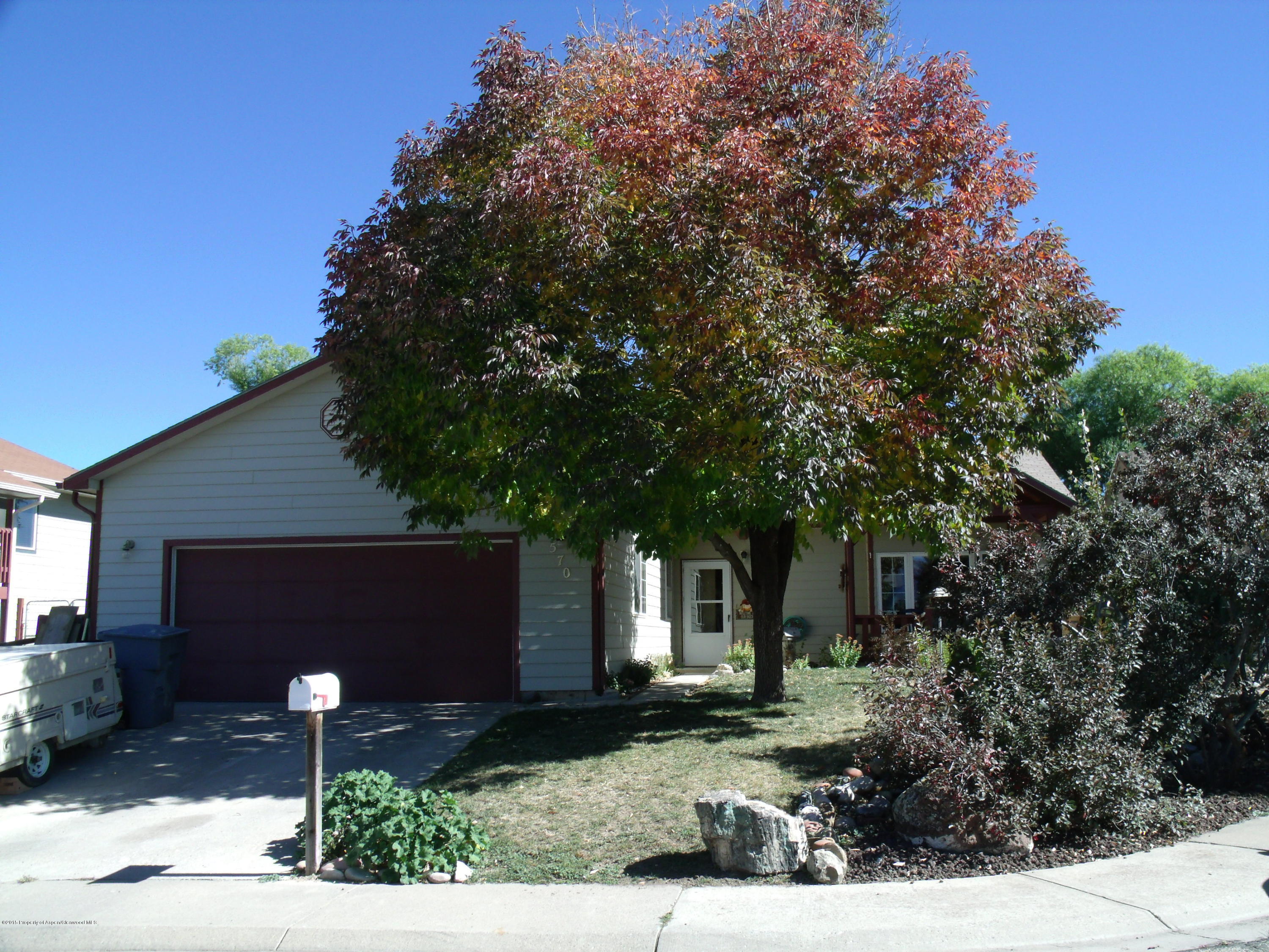 570 Elm Court Rifle, CO 81650 - Photo 2 of 15 a front view of a house with garden