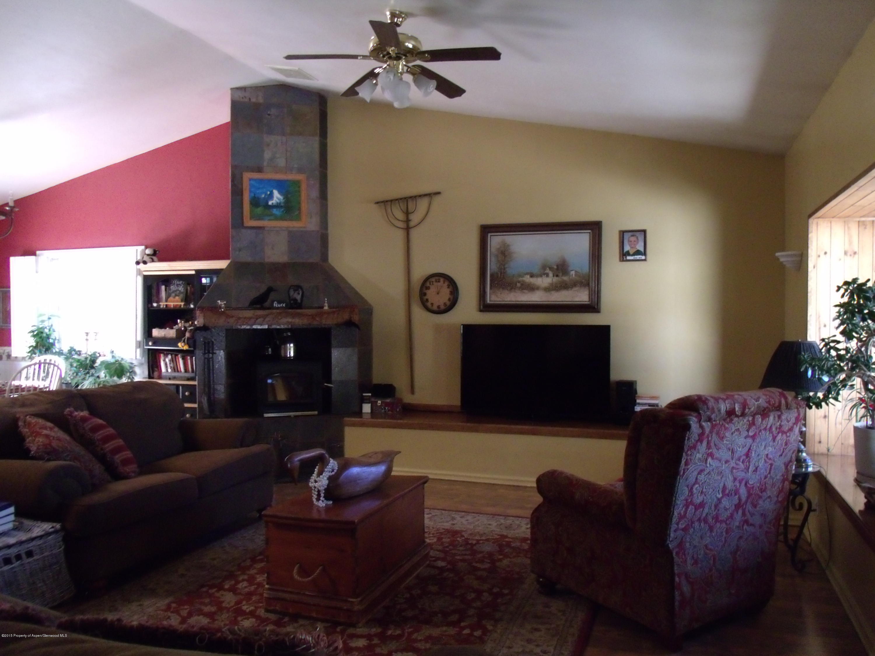 570 Elm Court Rifle, CO 81650 - Photo 3 of 15 a living room with furniture and a fireplace