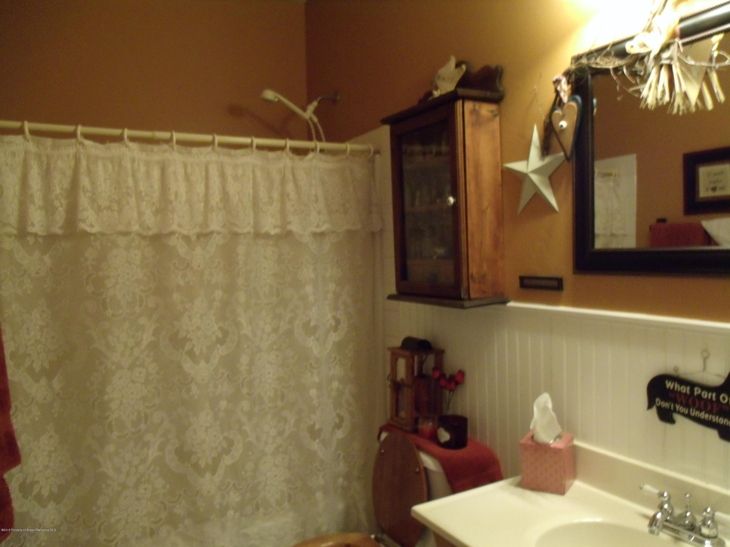 570 Elm Court Rifle, CO 81650 - Photo 10 of 15 a bathroom with a sink and a mirror