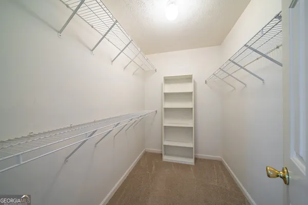 a view of an empty walk in closet