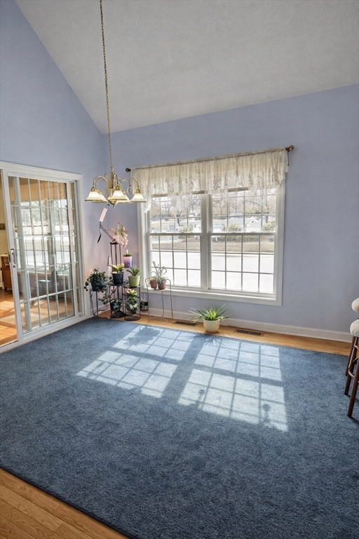 9 Arbor Road, Unit 9 Dracut, MA 01826 - Photo 5 of 27 a living room with furniture and a floor to ceiling window