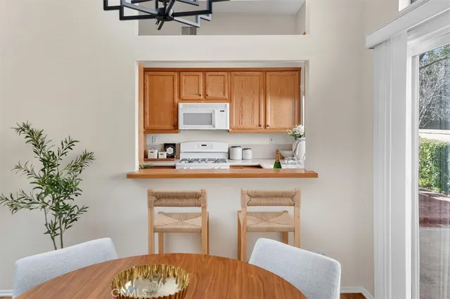 a kitchen with a sink cabinets and window