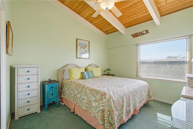 a bedroom with a bed and a table