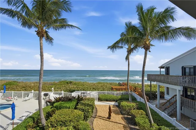 a view of a balcony with ocean view