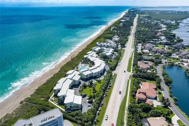 a view of a swimming pool with an outdoor space and seating area