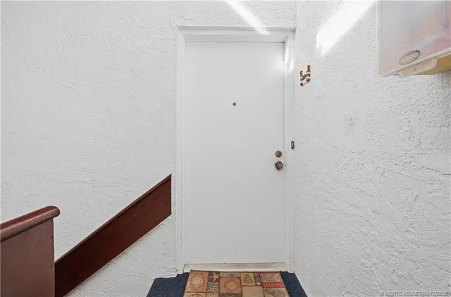 a bedroom with furniture and a flat screen tv