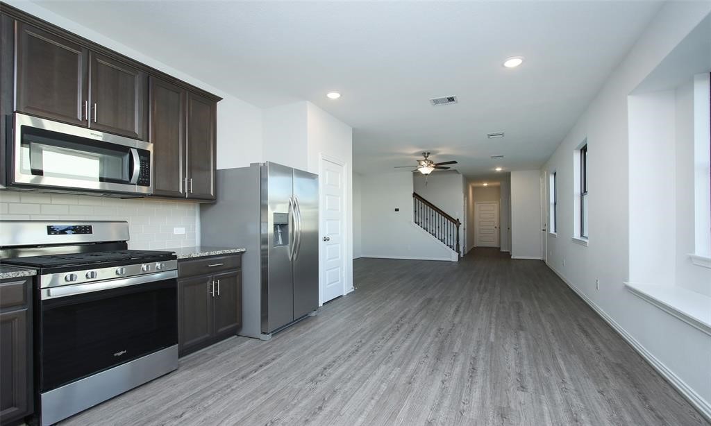 7124 Elgin Street Pearland, TX 77584 - Photo 2 of 14 Kitchen and Family Room (2021)