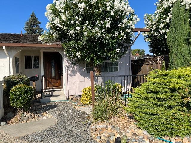 1652 Town Club Drive San Jose, CA 95124 - Photo 1 of 8 a front view of a house with garden