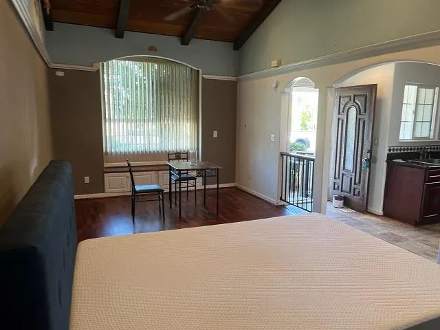 a view of a livingroom with furniture and windows