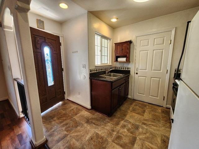 1652 Town Club Drive San Jose, CA 95124 - Photo 5 of 8 a view of a kitchen with a refrigerator wooden floor and cabinets