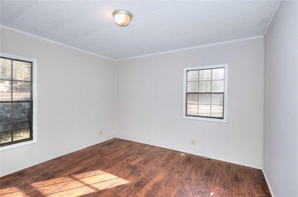 1210 Lee Peters Road Loganville, GA 30052 - Photo 14 of 32 an empty room with windows
