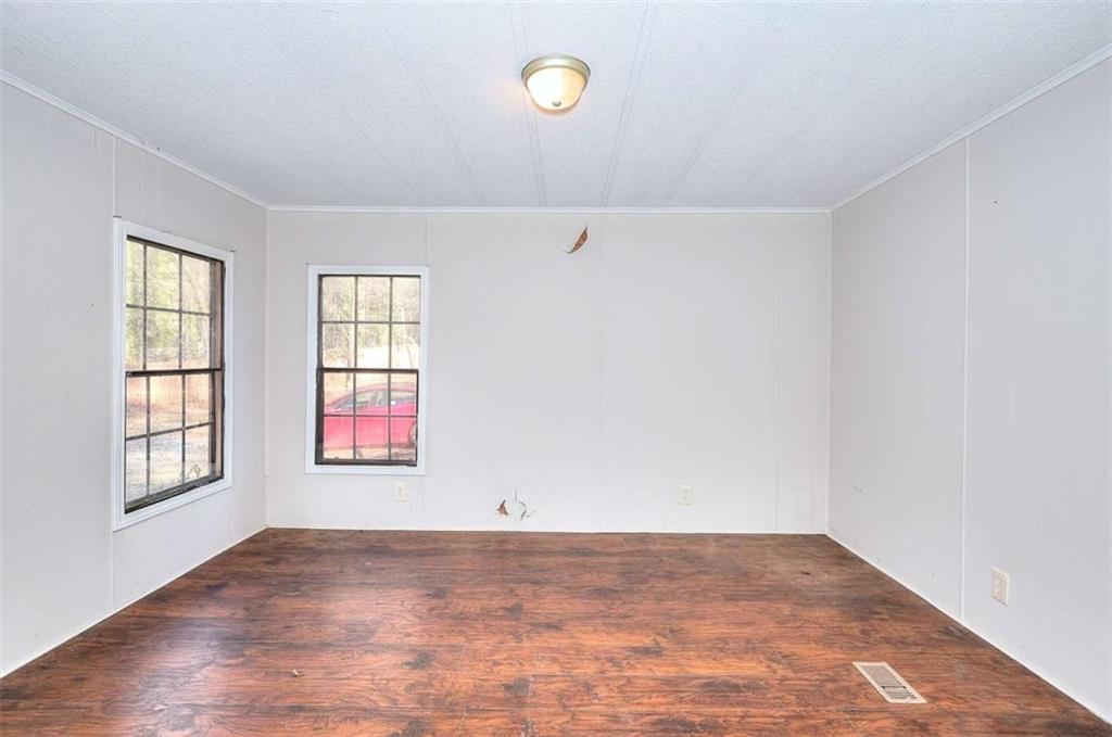 1210 Lee Peters Road Loganville, GA 30052 - Photo 17 of 32 an empty room with windows