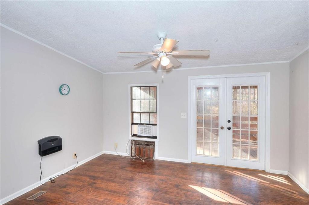 1210 Lee Peters Road Loganville, GA 30052 - Photo 22 of 32 a view of an empty room with a window