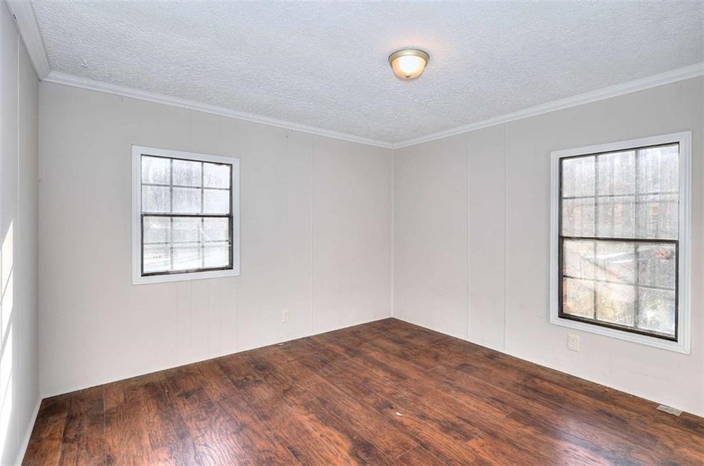 1210 Lee Peters Road Loganville, GA 30052 - Photo 28 of 32 an empty room with windows