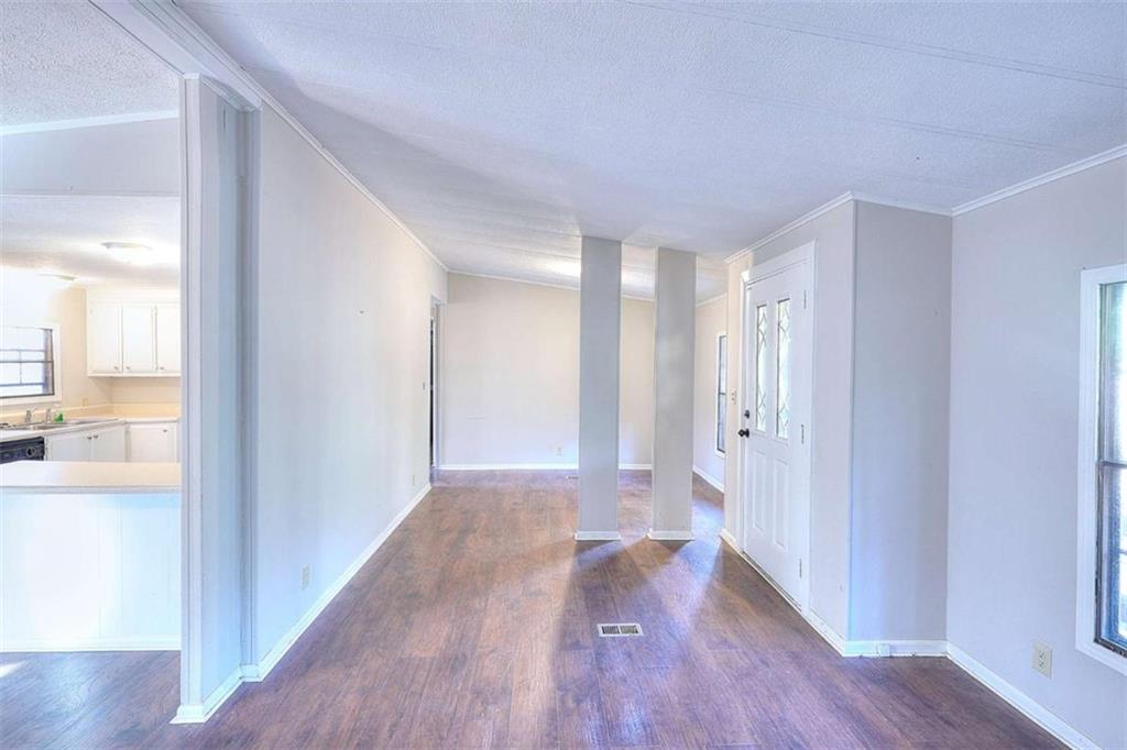 1210 Lee Peters Road Loganville, GA 30052 - Photo 8 of 32 a view of hallway with wooden floor