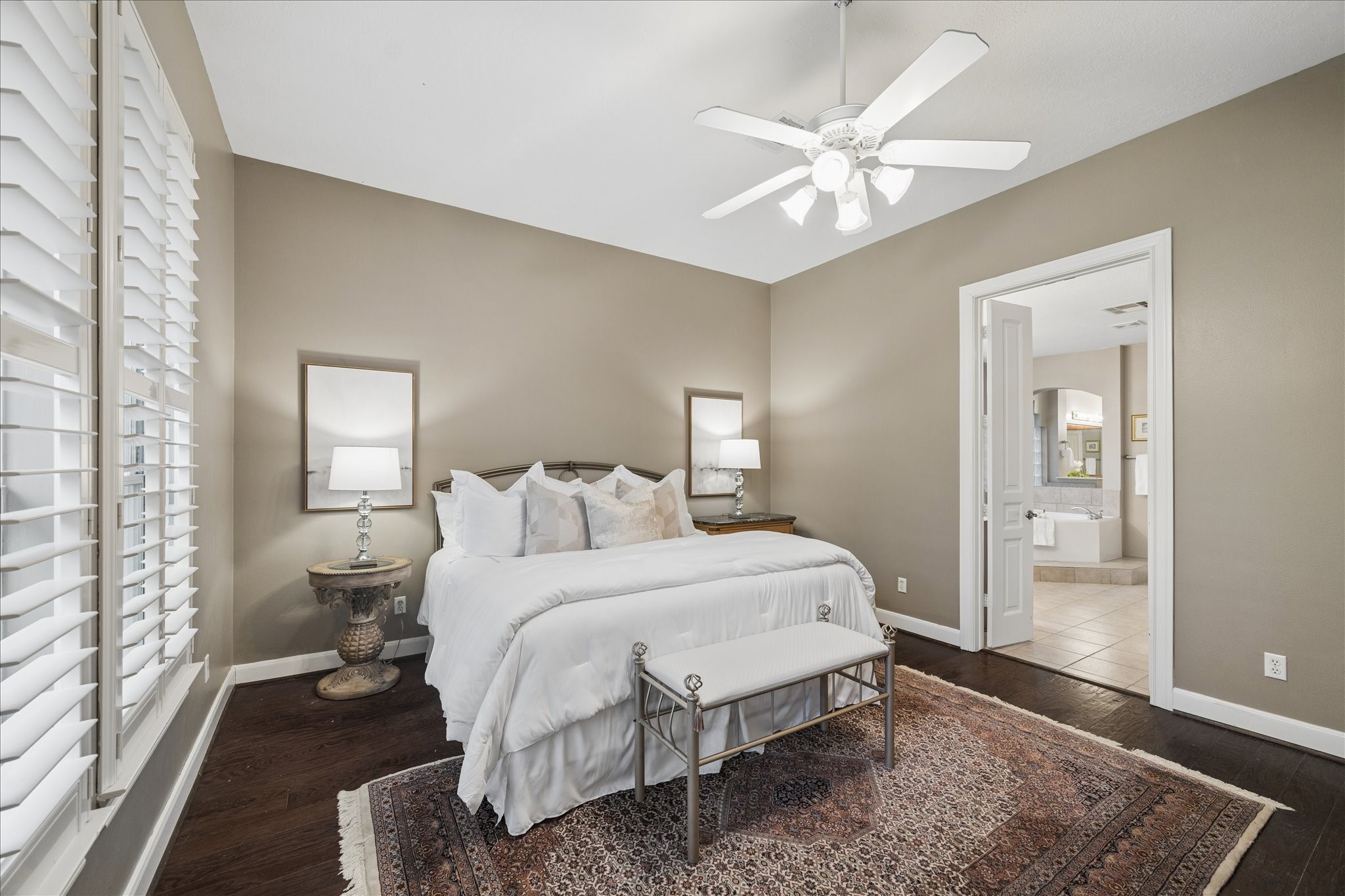14530 Millhouse Road Pinehurst, TX 77362 - Photo 19 of 46 Alternate view of the primary bedroom highlighting access to the ensuite bathroom.