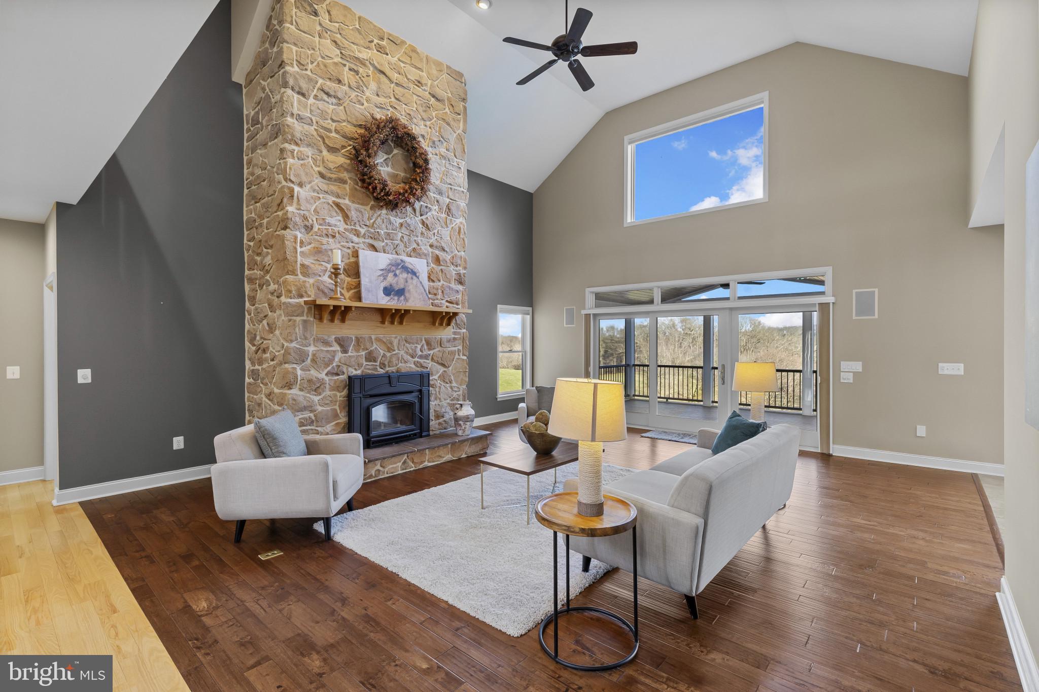 3239 Dry Branch Road White Hall, MD 21161 - Photo 12 of 56 a living room with furniture and a fireplace