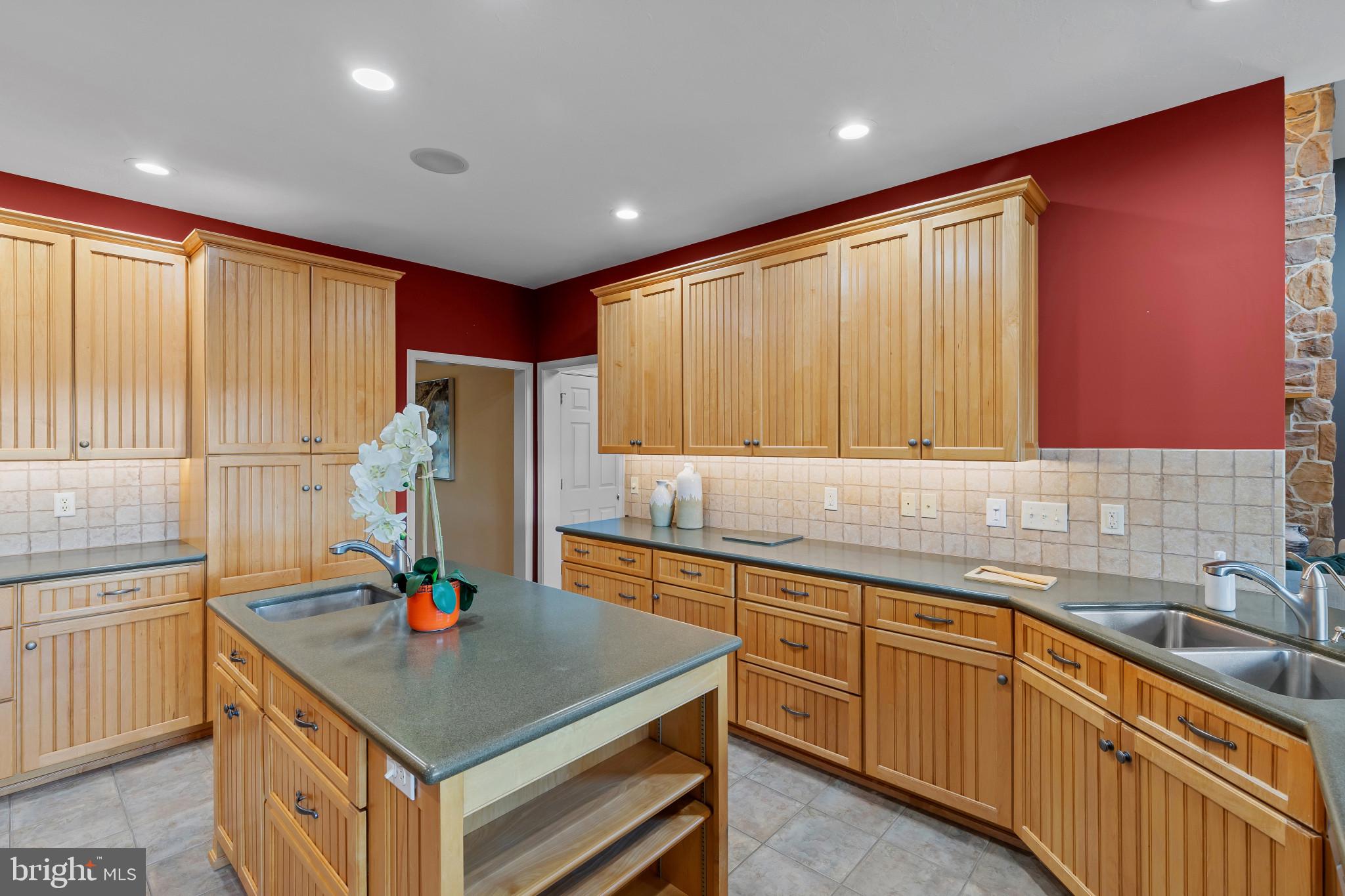 3239 Dry Branch Road White Hall, MD 21161 - Photo 22 of 56 a kitchen with kitchen island granite countertop a sink stainless steel appliances and cabinets