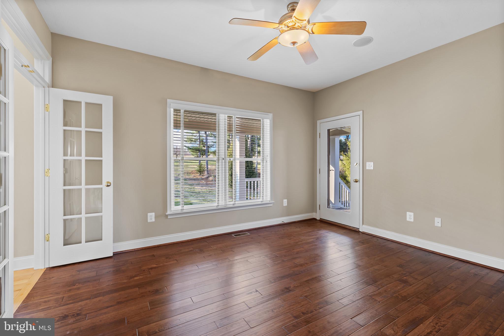 3239 Dry Branch Road White Hall, MD 21161 - Photo 26 of 56 a view of an empty room with window and wooden floor