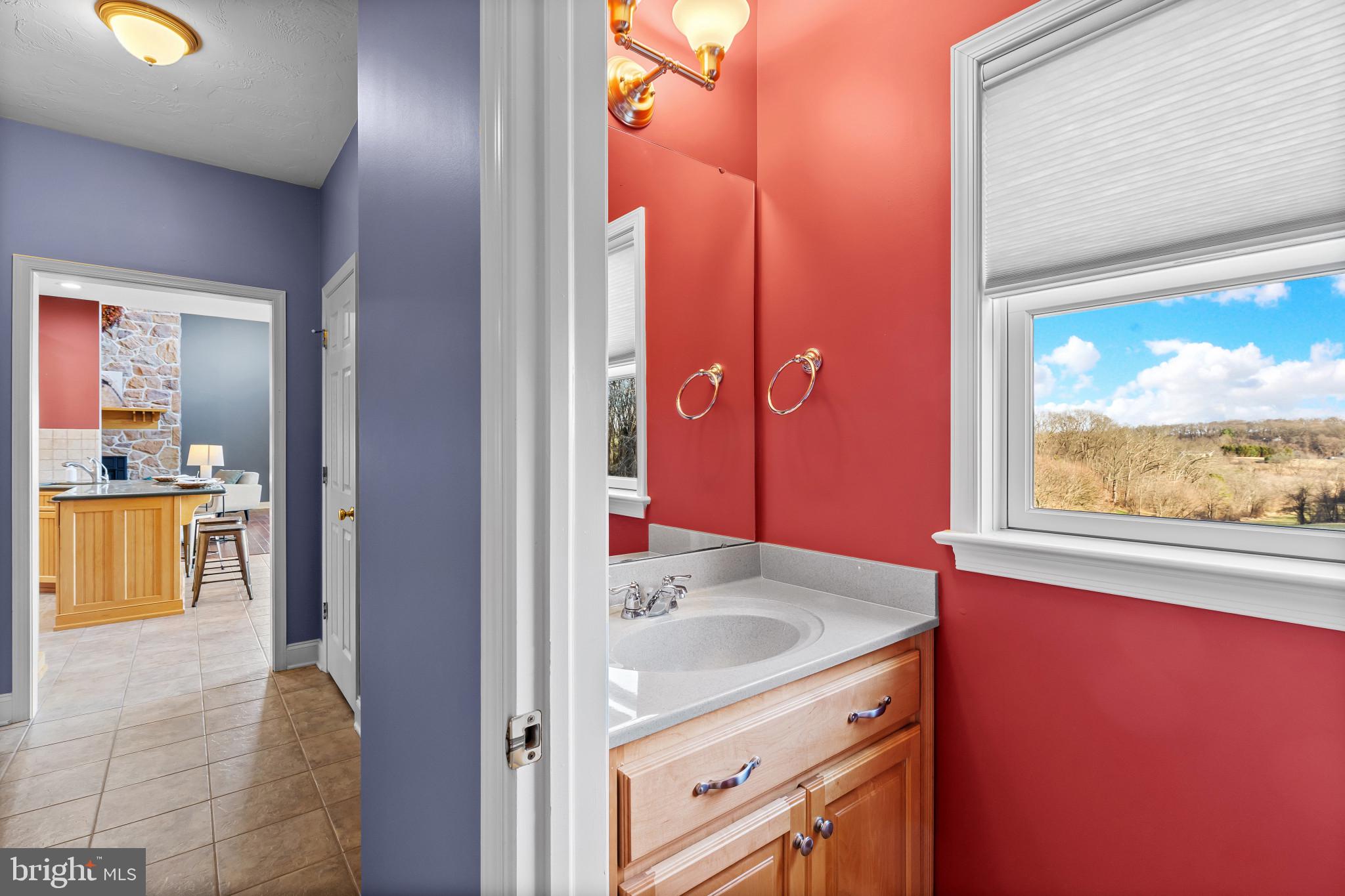 3239 Dry Branch Road White Hall, MD 21161 - Photo 30 of 56 a bathroom with a granite countertop sink a mirror and a bathtub