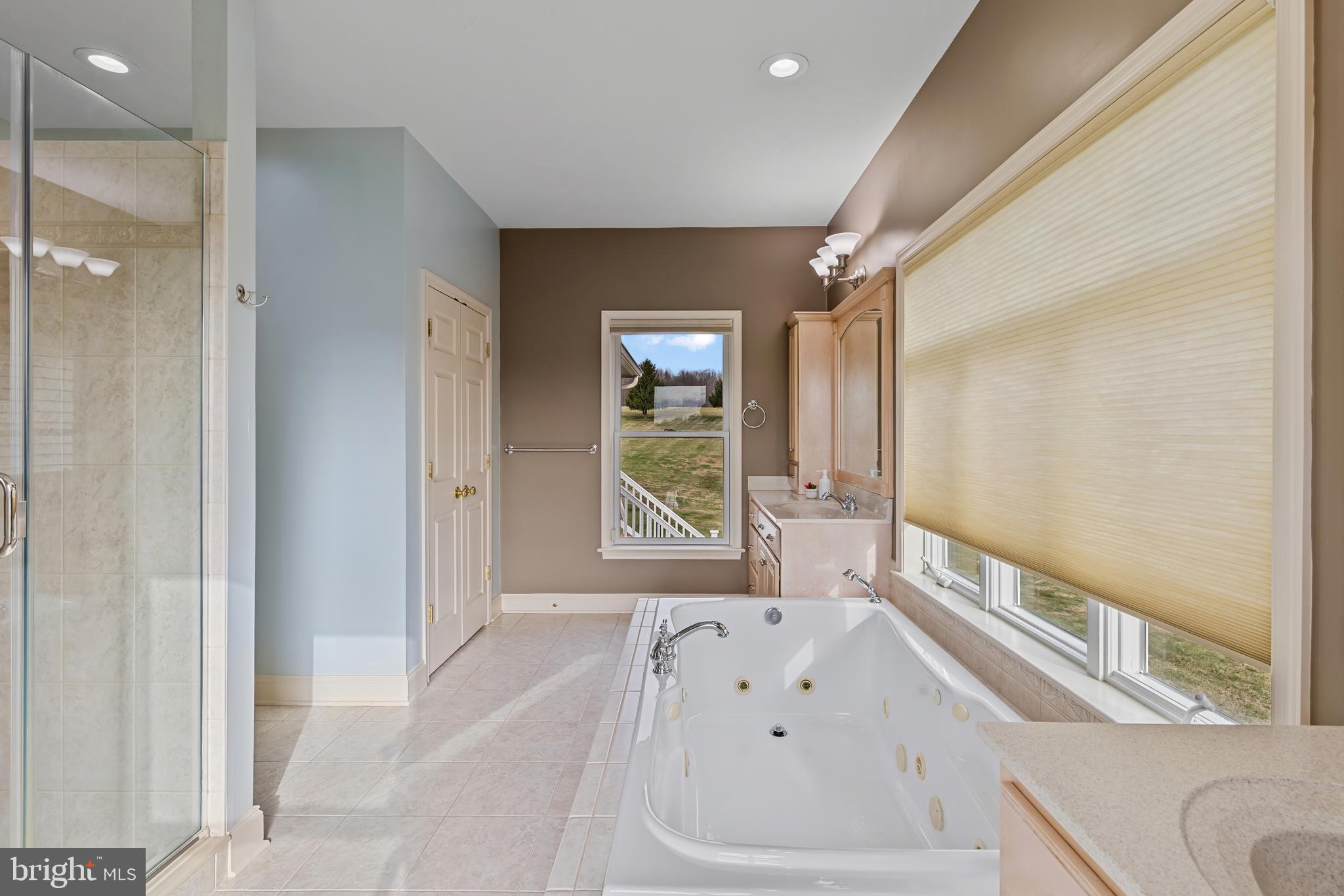 3239 Dry Branch Road White Hall, MD 21161 - Photo 35 of 56 a bathroom with a bathtub and a window