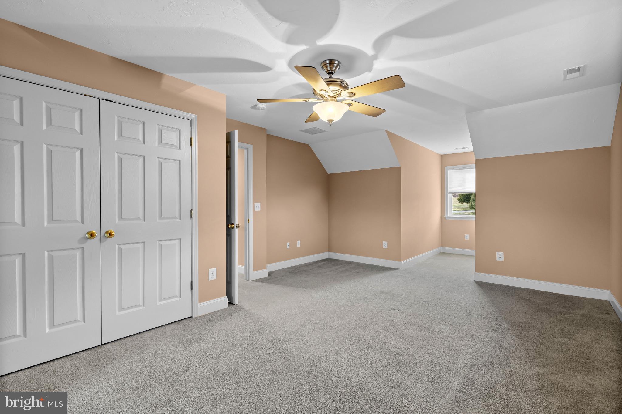 3239 Dry Branch Road White Hall, MD 21161 - Photo 40 of 56 an empty room with closet and a chandelier fan