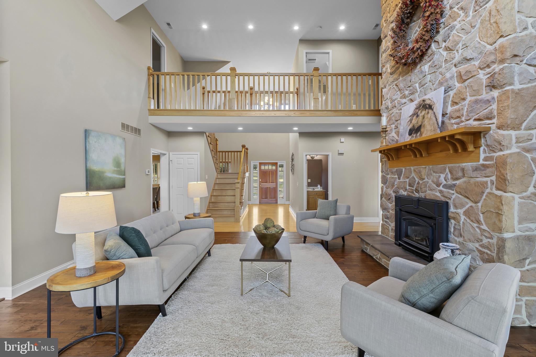 3239 Dry Branch Road White Hall, MD 21161 - Photo 5 of 56 a living room with furniture and a fireplace
