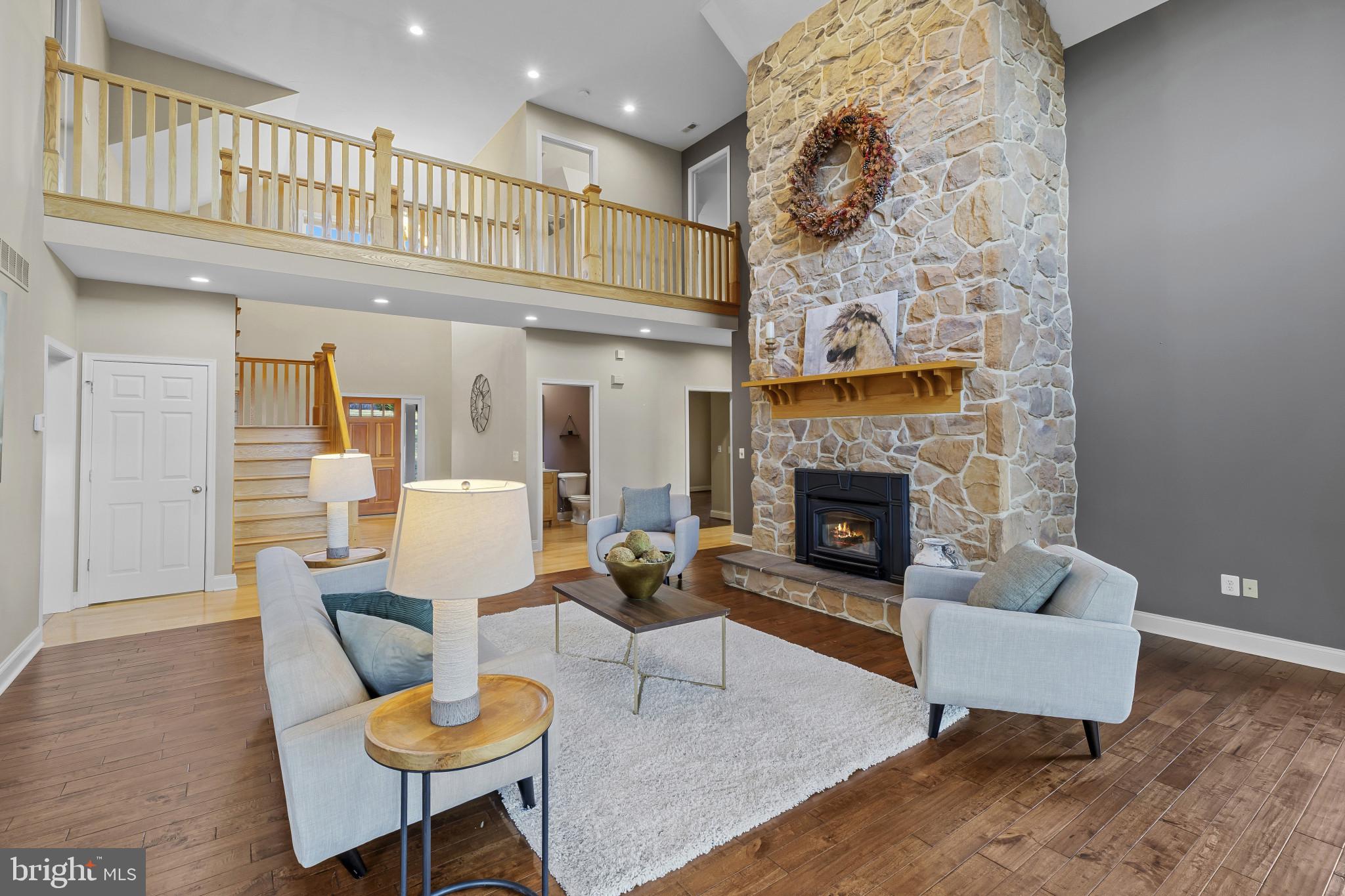 3239 Dry Branch Road White Hall, MD 21161 - Photo 7 of 56 a living room with furniture and a fireplace