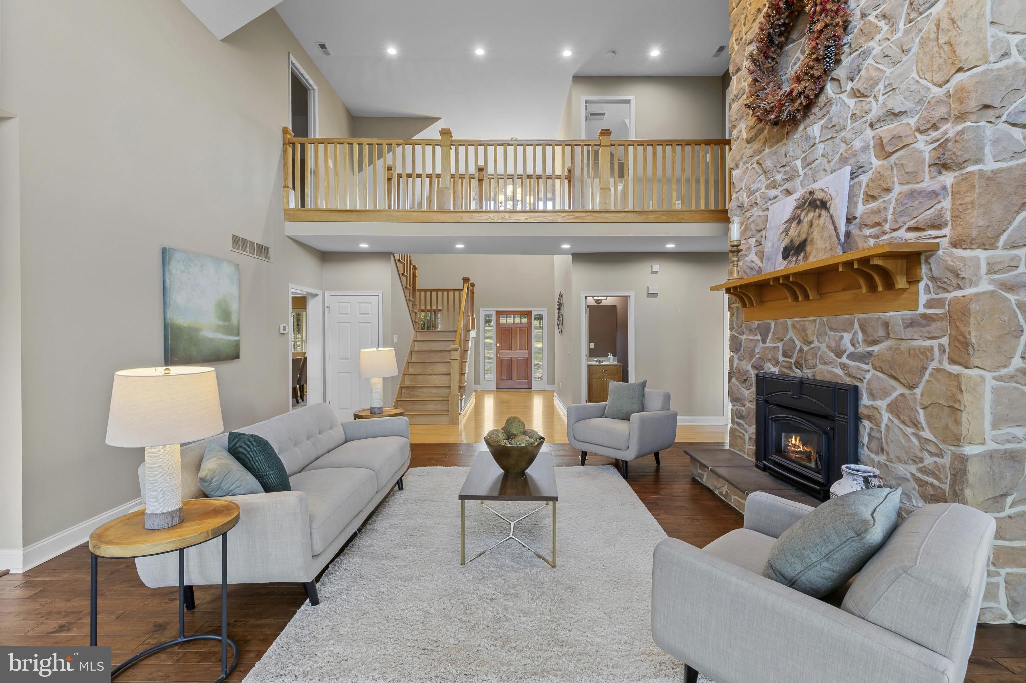 3239 Dry Branch Road White Hall, MD 21161 - Photo 8 of 56 a living room with furniture and a fireplace
