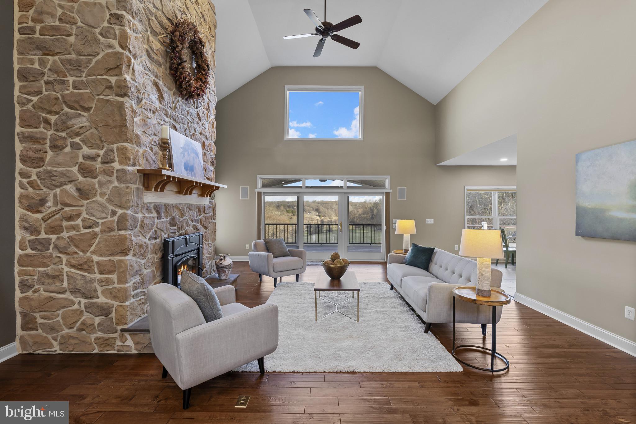 3239 Dry Branch Road White Hall, MD 21161 - Photo 9 of 56 a living room with fireplace furniture and a wooden floor