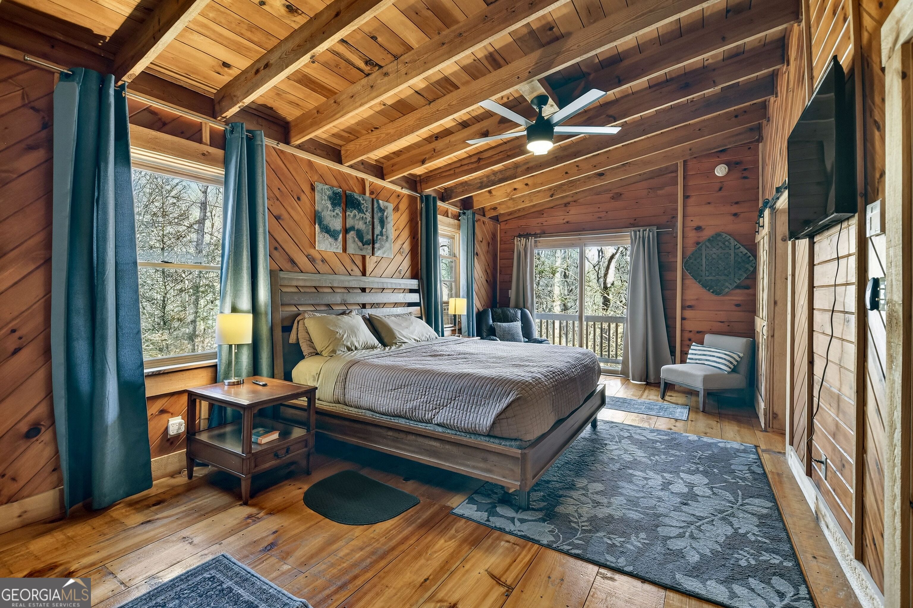 134 Hemlock Circle, Unit 54 Blue Ridge, GA 30513 - Photo 24 of 43 a bedroom with a bed wooden floor and next to a window