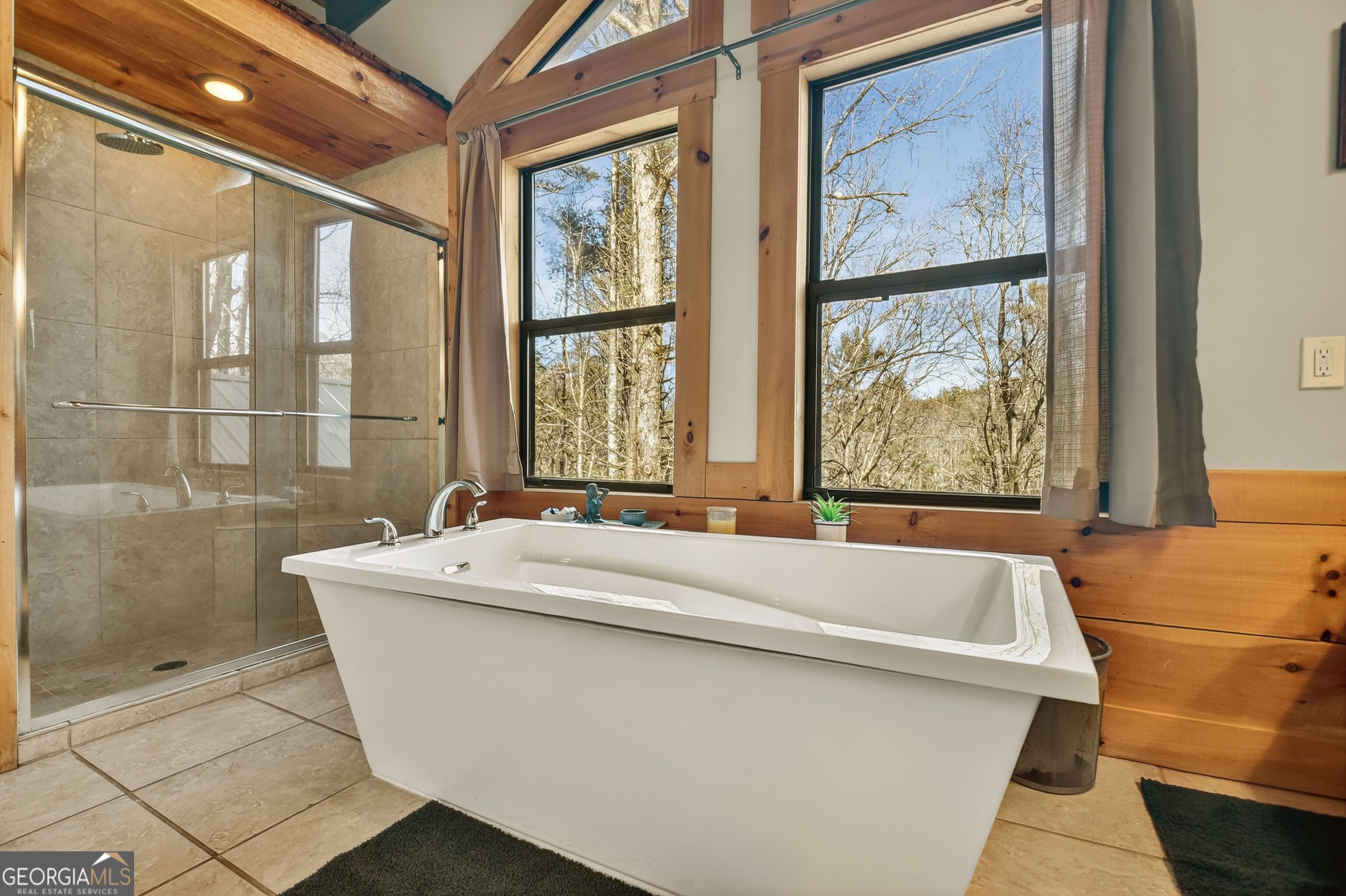 134 Hemlock Circle, Unit 54 Blue Ridge, GA 30513 - Photo 26 of 43 a bath tub sitting next to a window