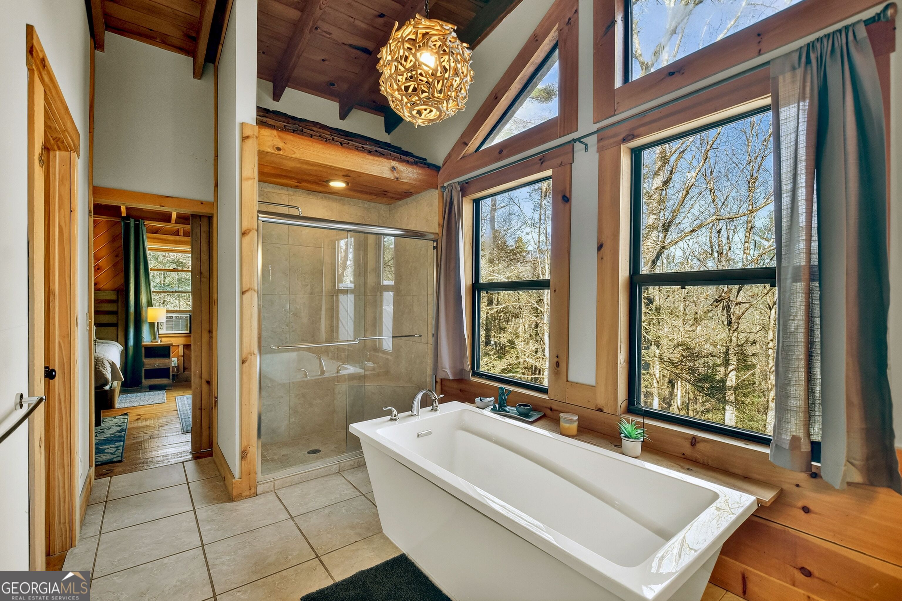 134 Hemlock Circle, Unit 54 Blue Ridge, GA 30513 - Photo 28 of 43 a bathroom with a tub and a shower