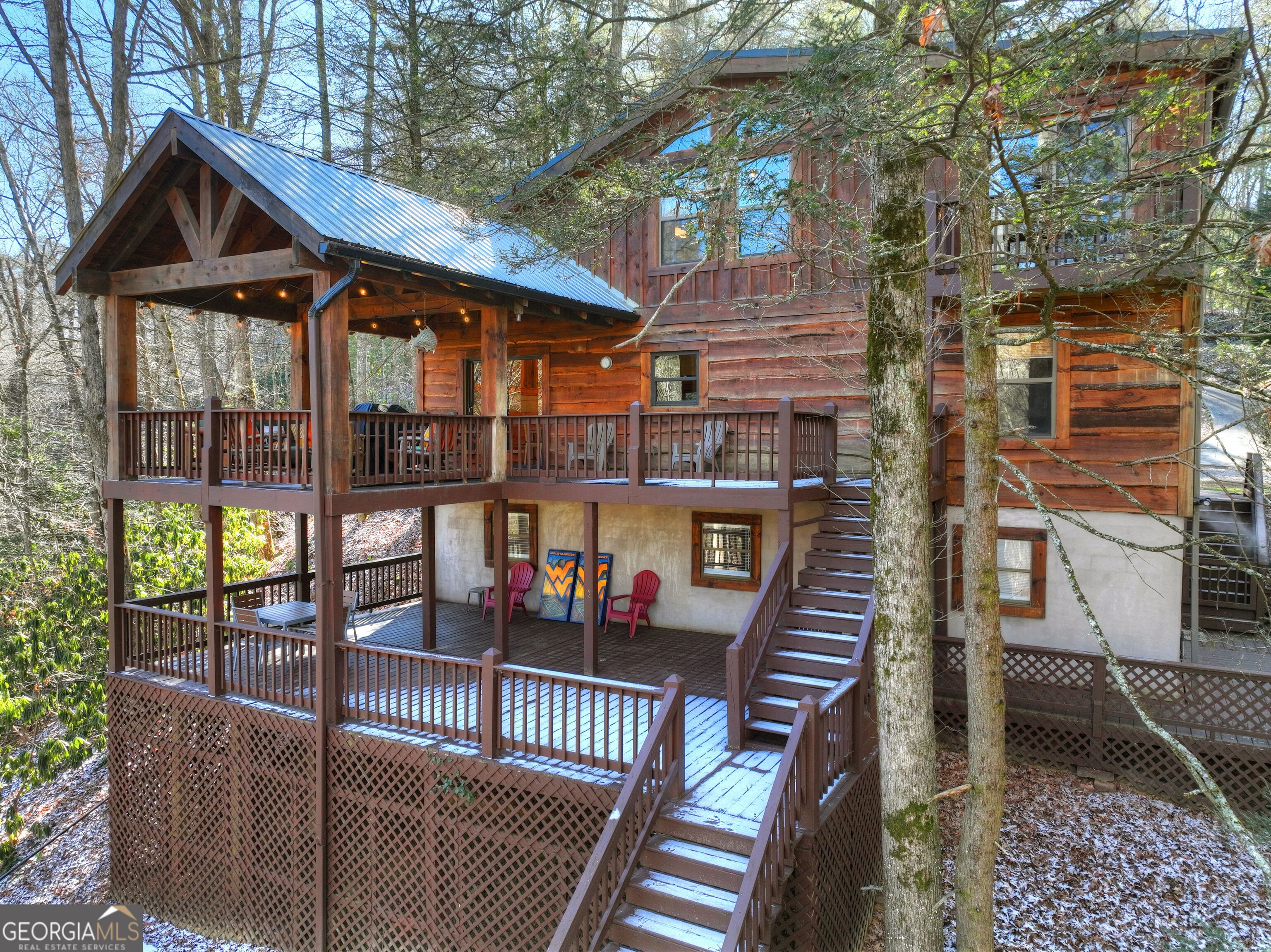134 Hemlock Circle, Unit 54 Blue Ridge, GA 30513 - Photo 3 of 43 a balcony with table and chairs