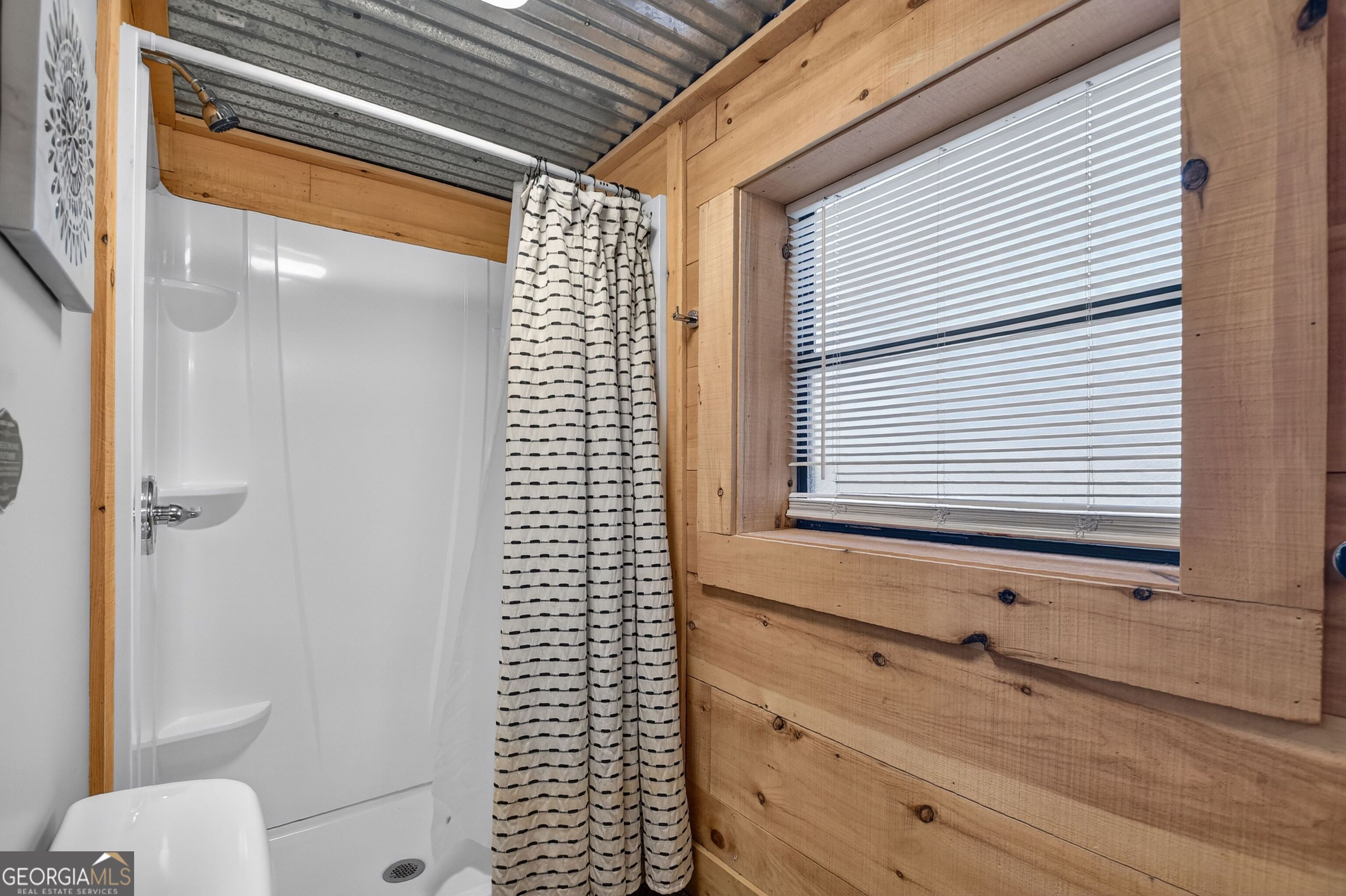 134 Hemlock Circle, Unit 54 Blue Ridge, GA 30513 - Photo 37 of 43 a bathroom with a bathtub and shower