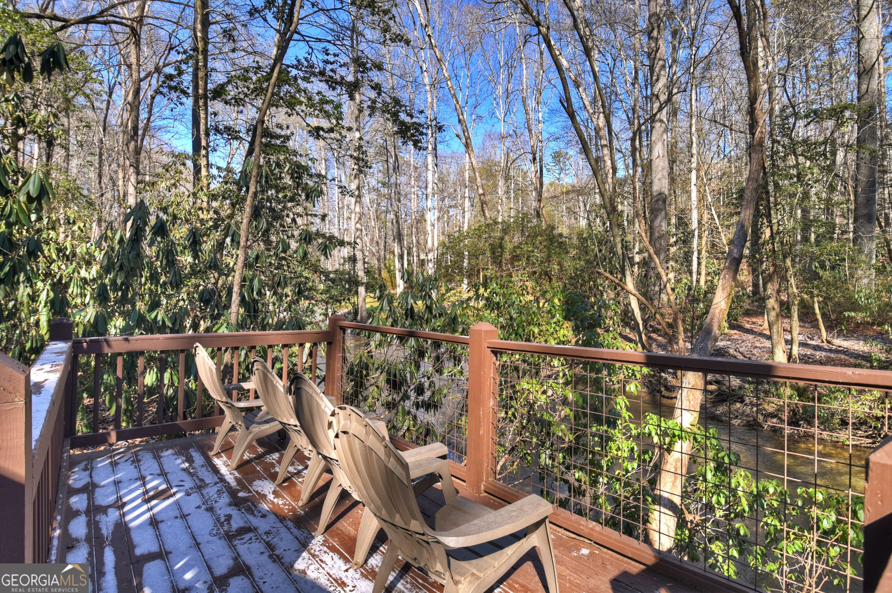 134 Hemlock Circle, Unit 54 Blue Ridge, GA 30513 - Photo 41 of 43 a view of a balcony with wooden floor and fence