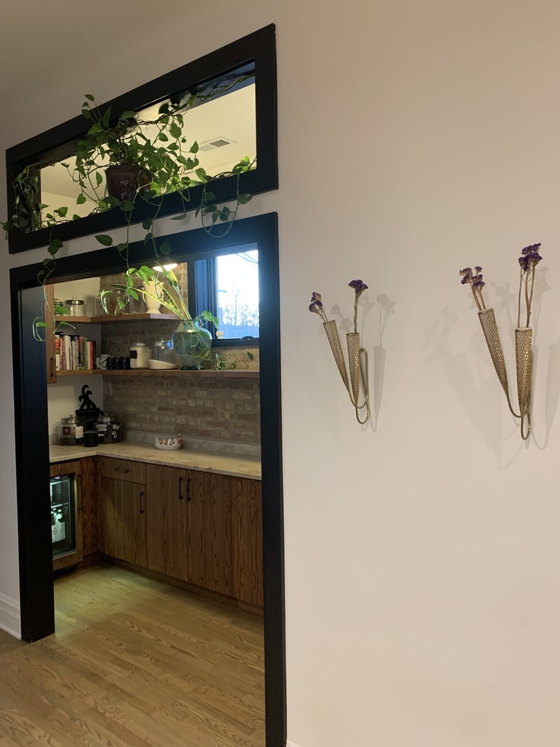 5259 West Roscoe Street, Unit 1F Chicago, IL 60641 - Photo 11 of 53 a view of a living room with a flat screen tv