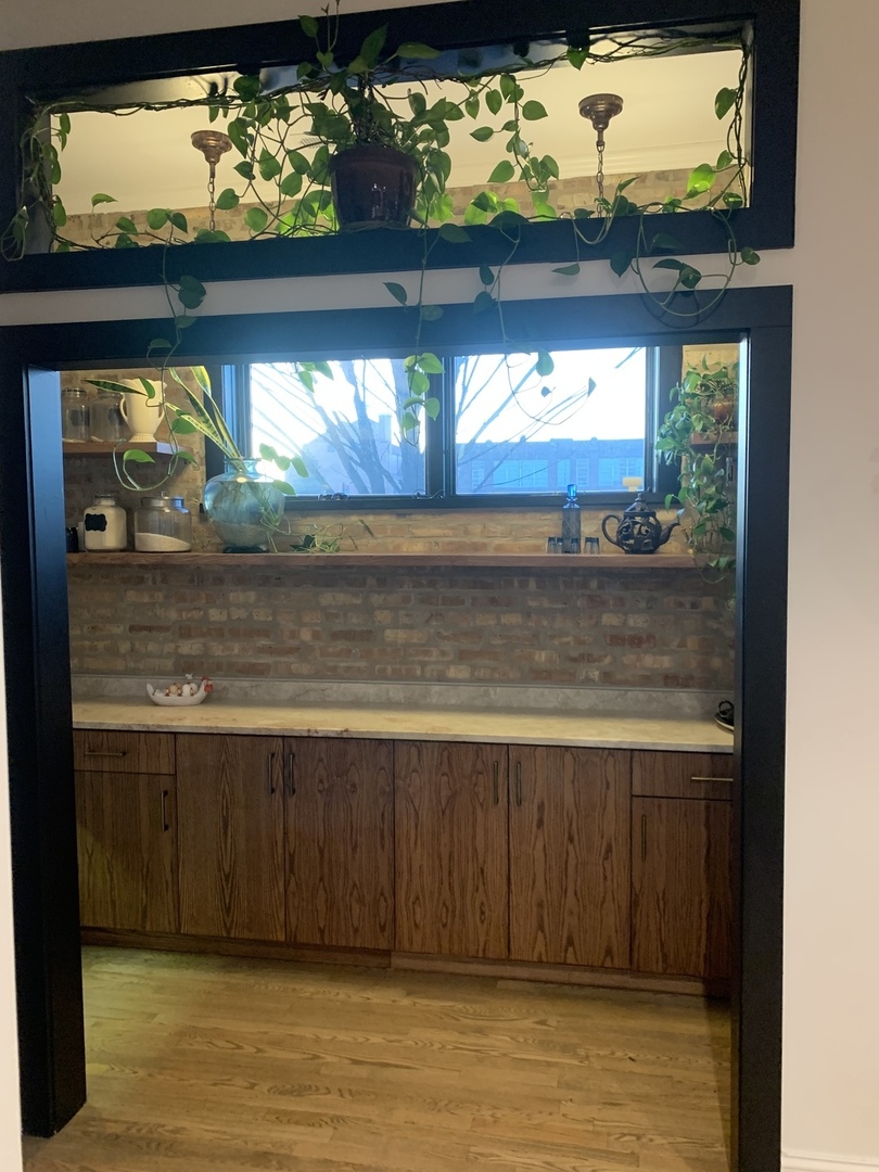 5259 West Roscoe Street, Unit 1F Chicago, IL 60641 - Photo 12 of 53 a view of a room with a bed