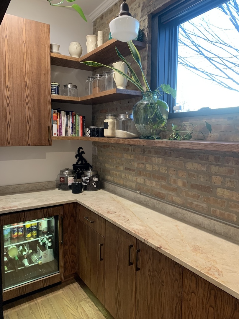 5259 West Roscoe Street, Unit 1F Chicago, IL 60641 - Photo 13 of 53 a kitchen with a sink and cabinets