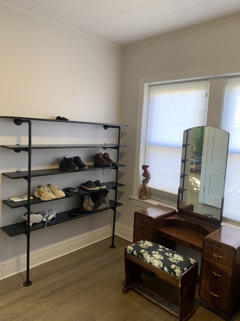 5259 West Roscoe Street, Unit 1F Chicago, IL 60641 - Photo 24 of 53 a living room with furniture