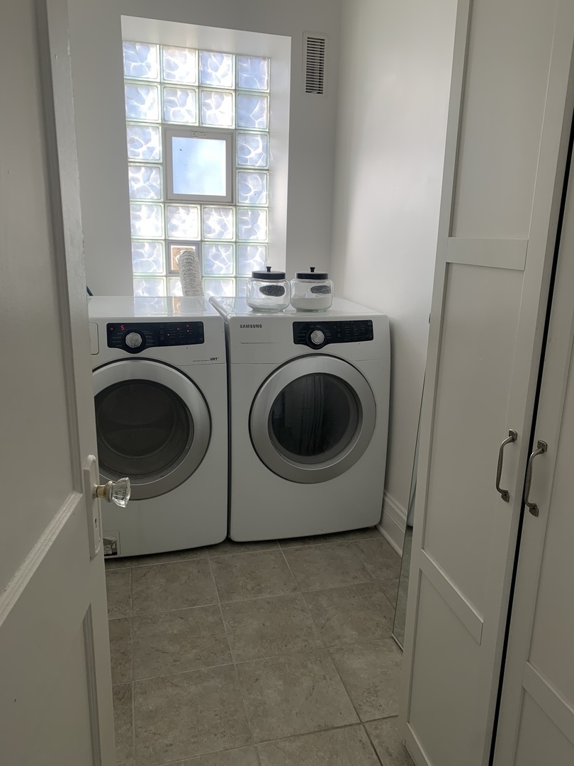 5259 West Roscoe Street, Unit 1F Chicago, IL 60641 - Photo 30 of 53 a utility room with dryer and washer