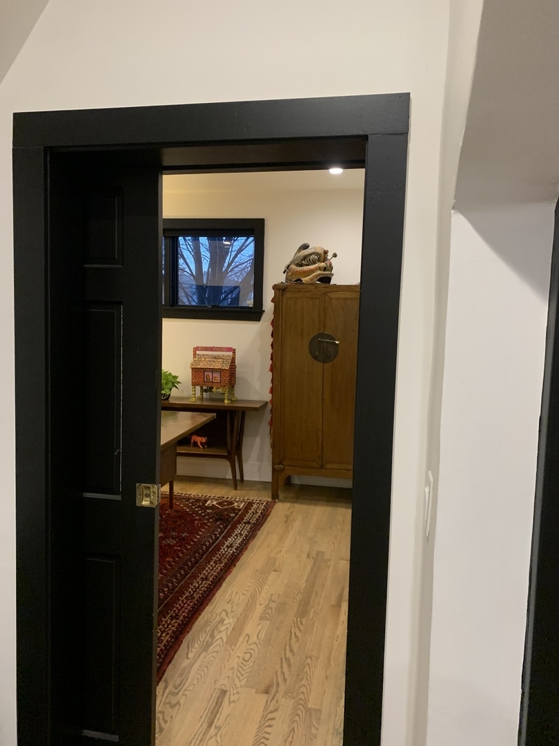 5259 West Roscoe Street, Unit 1F Chicago, IL 60641 - Photo 37 of 53 a view of a living room and bathroom