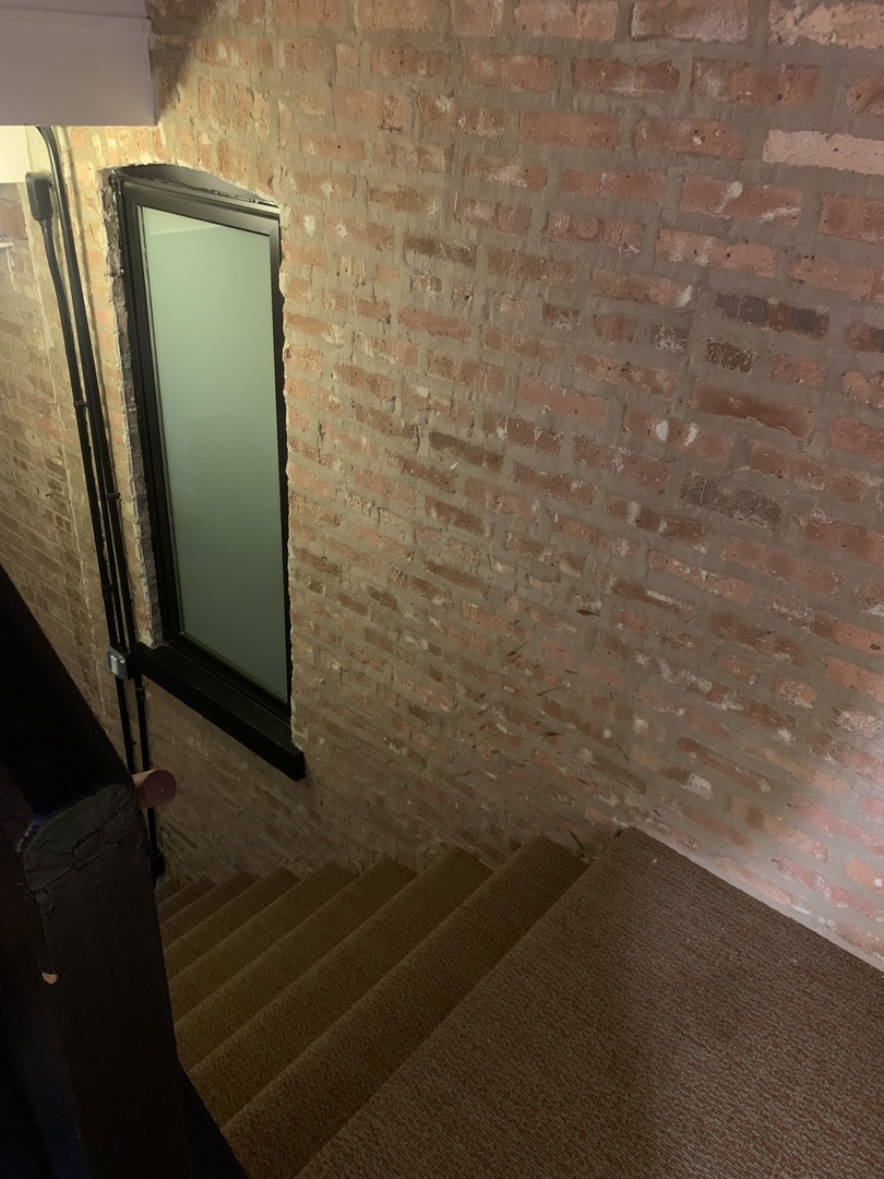 5259 West Roscoe Street, Unit 1F Chicago, IL 60641 - Photo 46 of 53 a bathroom with a shower