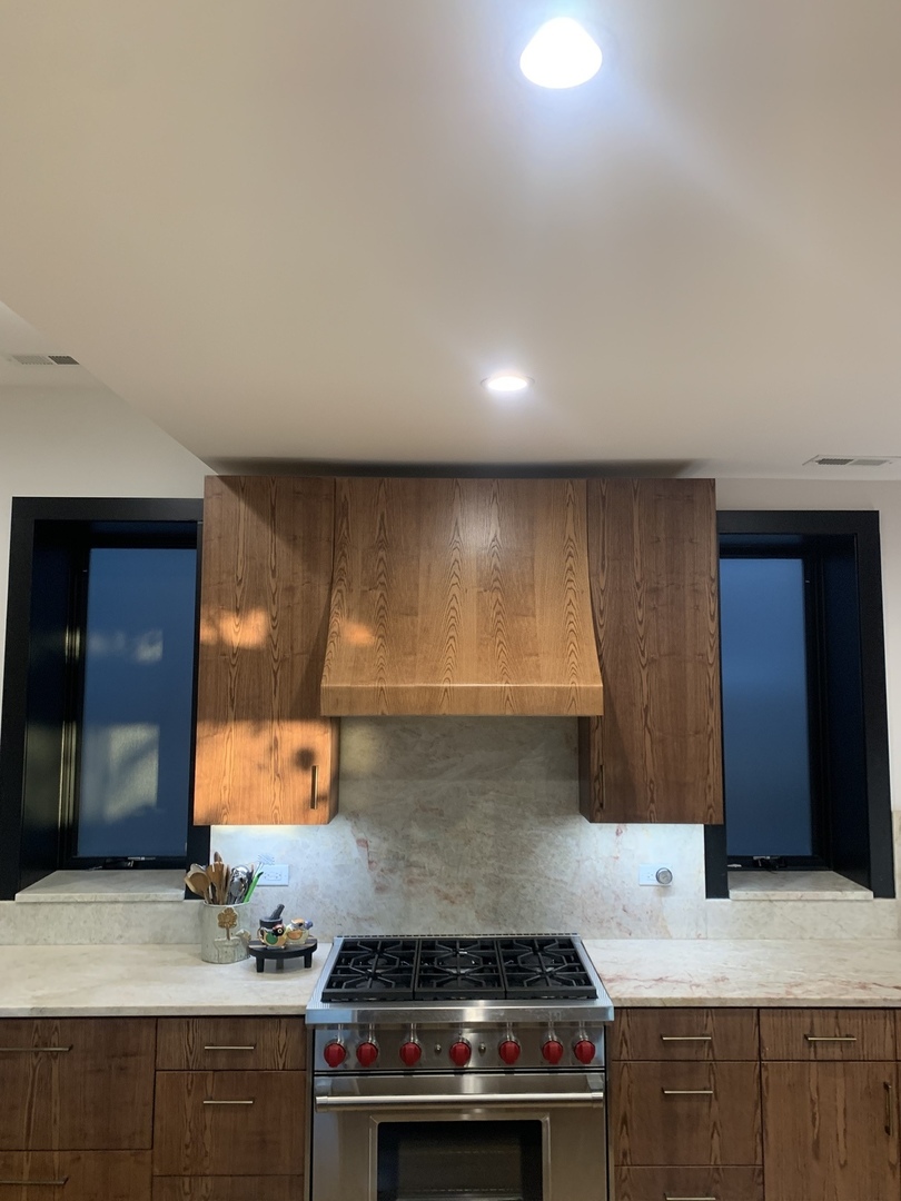 5259 West Roscoe Street, Unit 1F Chicago, IL 60641 - Photo 7 of 53 a kitchen with a stove and a sink