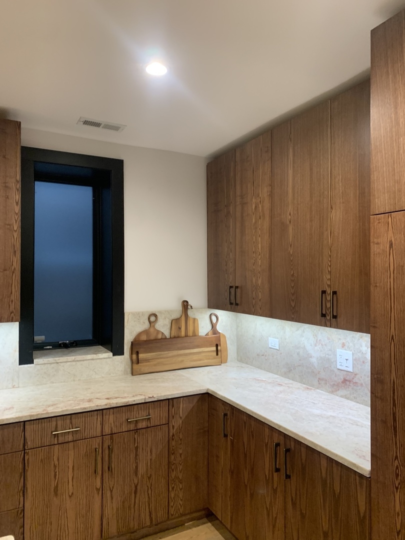 5259 West Roscoe Street, Unit 1F Chicago, IL 60641 - Photo 8 of 53 a bathroom with a sink and a mirror